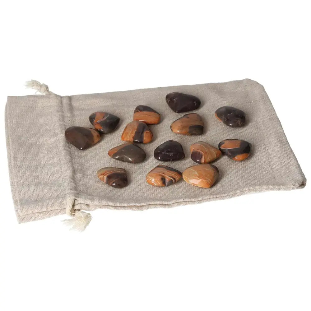 Jasper Tiger Small Heart stones on linen pouch, promoting harmony, peace, and balance. Enhance well-being and strength with positive energy.