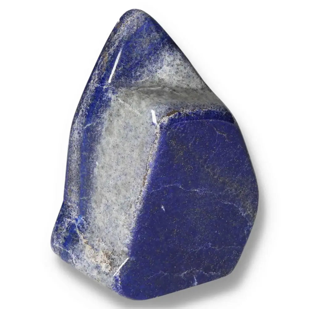 Lapis Lazuli Obelisk with deep blue hues and golden pyrite flecks, sourced from Pakistan, a symbol of wisdom and inner power.