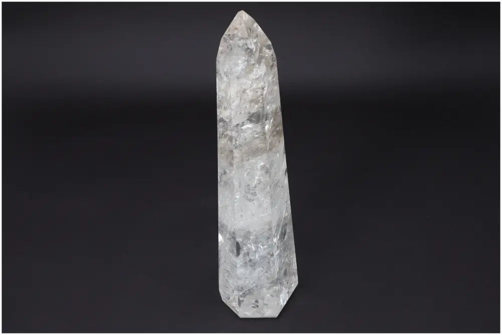 Large Lemurian Quartz Obelisk on black background, known for clarity and balance, hand-selected and ethically sourced.
