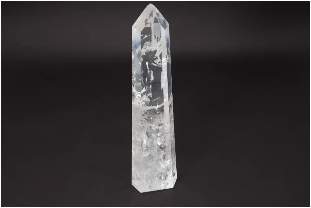 Large Lemurian Quartz Obelisk on black background, known for clarity, balance, and personal growth. Ethically sourced, natural formation.
