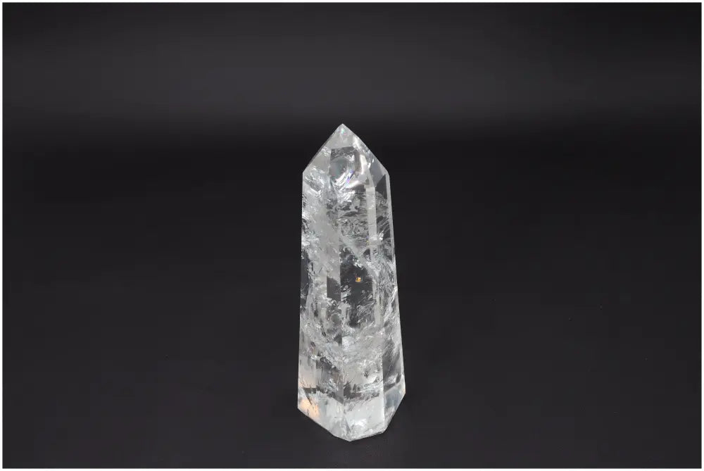 Large Lemurian Quartz Obelisk for clarity and balance, clear quartz crystal known as the Master Healer on a dark background.