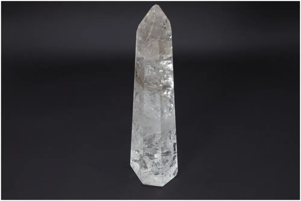 Large Lemurian Quartz Obelisk crystal with natural clarity, known as the Master Healer, amplifying energy and promoting personal growth.