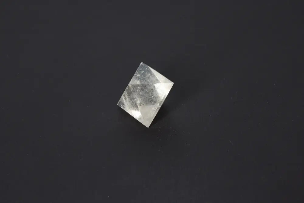 Lemurian Quartz Double Pyramid 3 cm against a black background, showcasing sacred geometry and ethereal clarity.