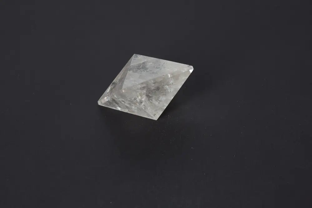 Lemurian Quartz Double Pyramid 5 cm showcasing sacred geometry and ancient wisdom against a dark background.