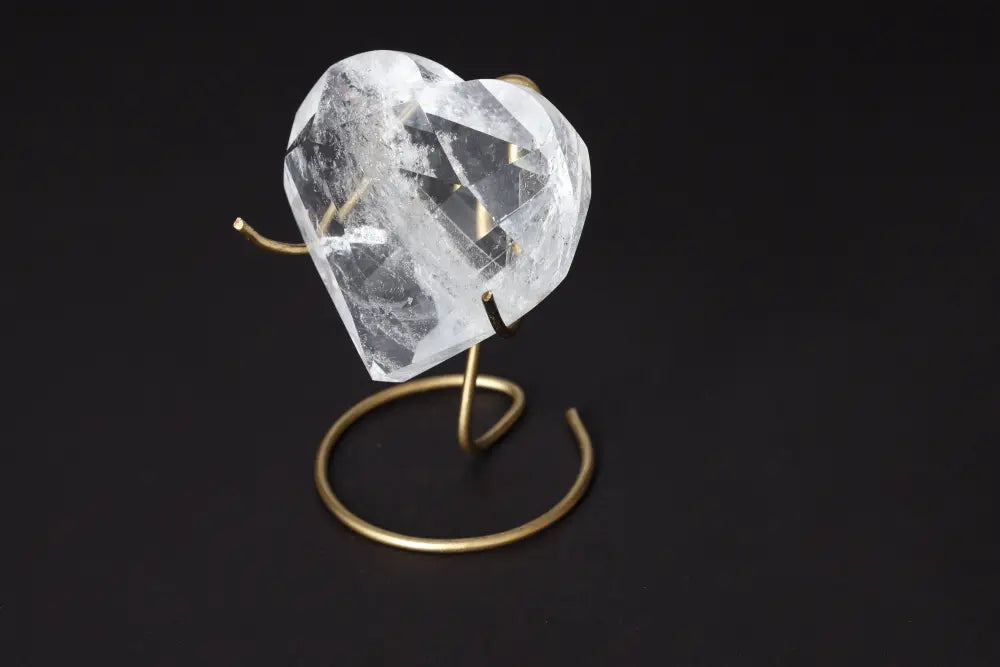 Lemurian Quartz Geometric Heart on a brass stand, symbolizing luxury and spiritual harmony by Sylvia Crystals.