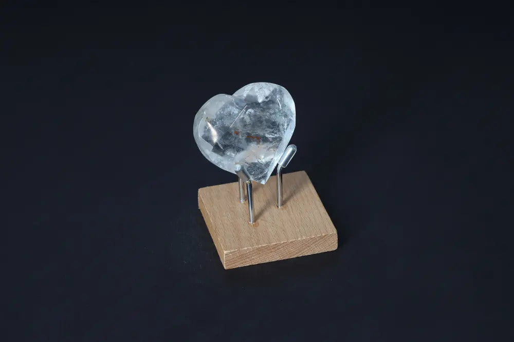 Lemurian Quartz Geometric Heart on wooden stand, premium crystal by Sylvia Crystals, known for purification and harmony.