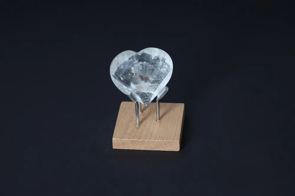 Lemurian Quartz Geometric Heart on wooden stand, crafted for luxury and purification from Sylvia Crystals.