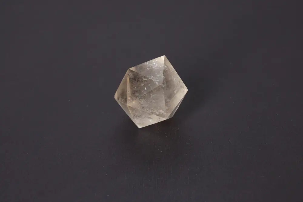Lemurian Quartz Geometric Sphere displaying sacred geometry and spiritual connection on a dark background. Ideal for intuition awakening.