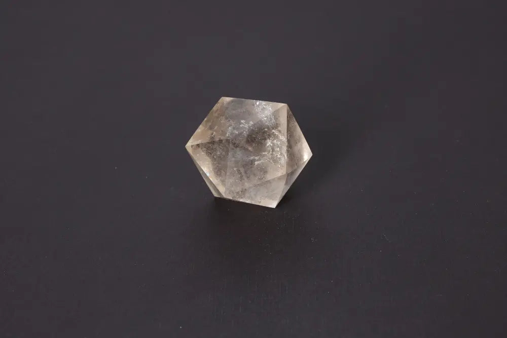 Alt Tag: Lemurian Quartz Geometric Sphere 5 cm displaying ethereal clarity and sacred geometry on a dark background