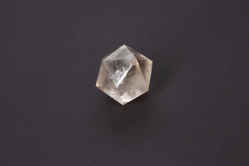 Lemurian Quartz geometric sphere showcasing sacred geometry and ancient wisdom on a dark background.