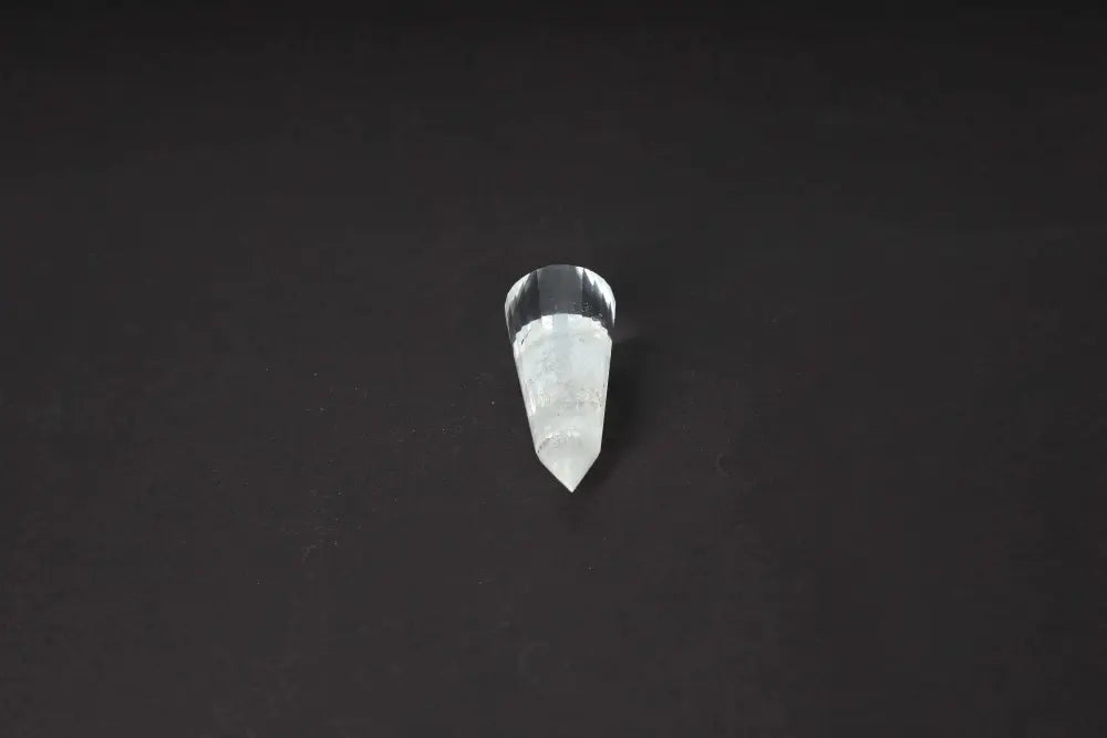 Lemurian Quartz Point crystal with ancient wisdom striations, believed to hold Lemurian civilization energies, on a dark background.