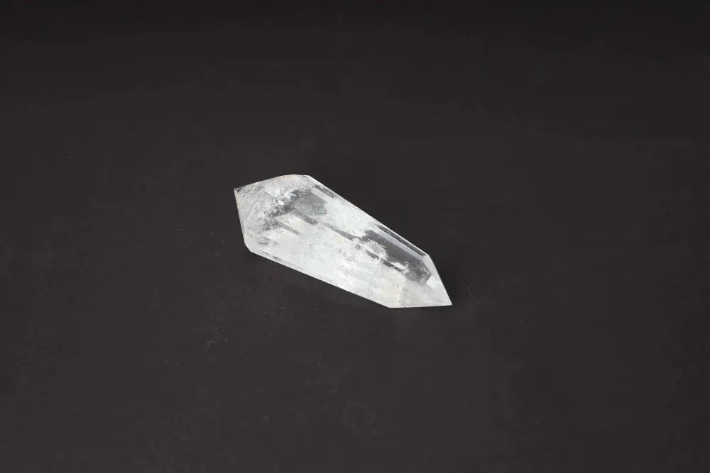 Lemurian Quartz Point crystal with distinct striations, representing ancient wisdom from a mythical advanced civilization.