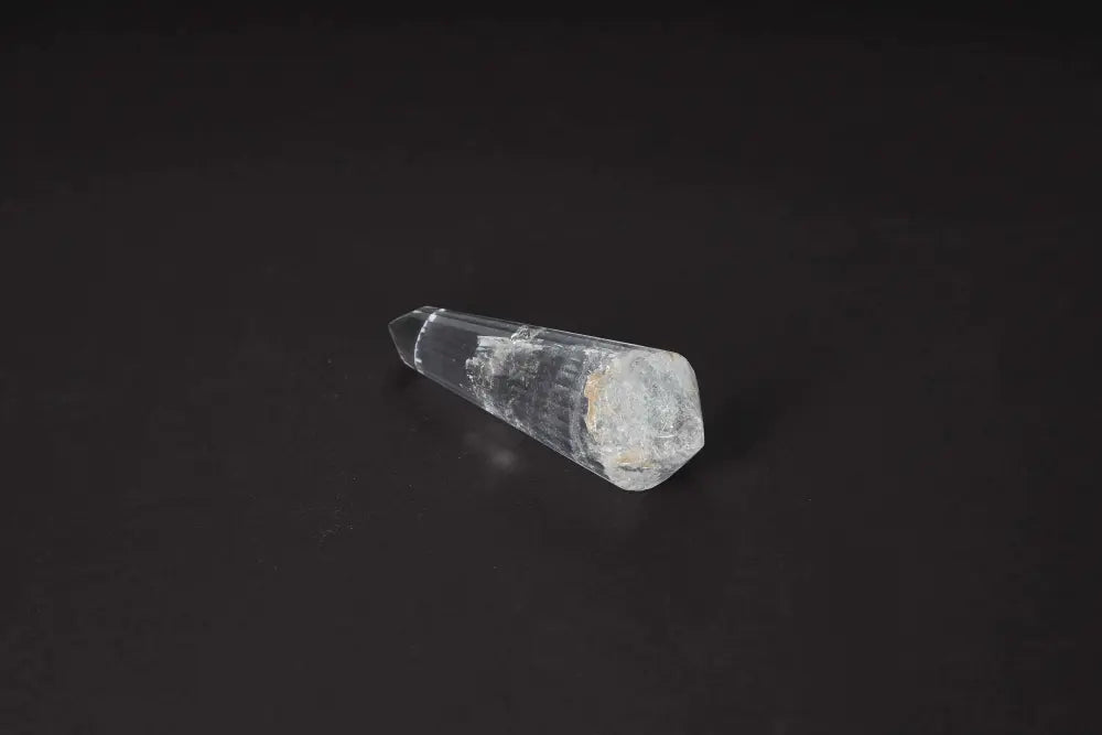 Lemurian Quartz Point on black background, showcasing ancient wisdom with distinct horizontal striations representing Lemurian energies.