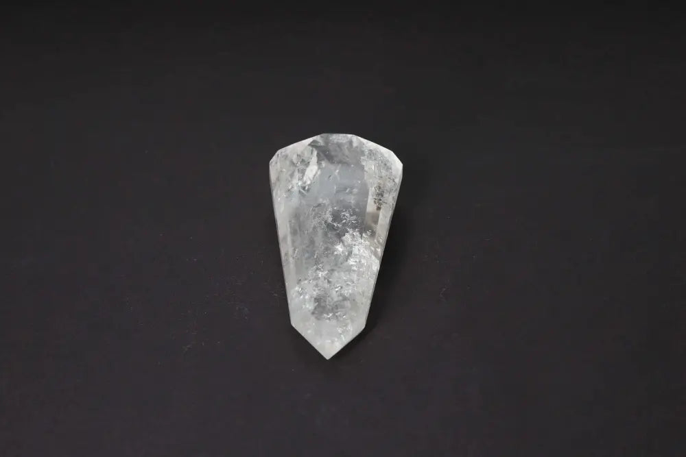 Lemurian Quartz Point crystal on black background showcasing horizontal striations symbolizing ancient wisdom from a mythical civilization.