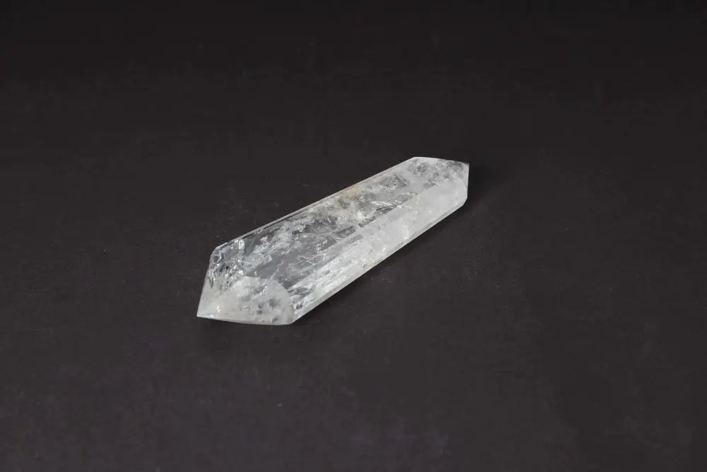 Lemurian Quartz Point with ancient wisdom striations on a dark background
