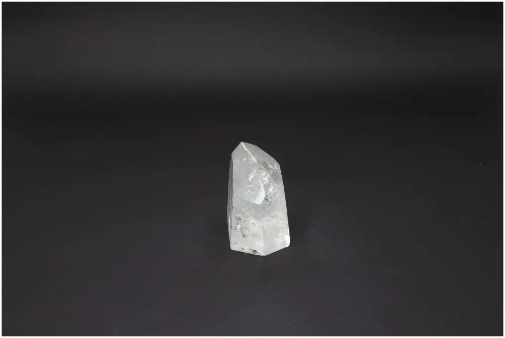 Lemurian Quartz Obelisk from Sylvia Crystals, showcasing a premium gemstone emphasizing luxury and spiritual wellness on a dark background.