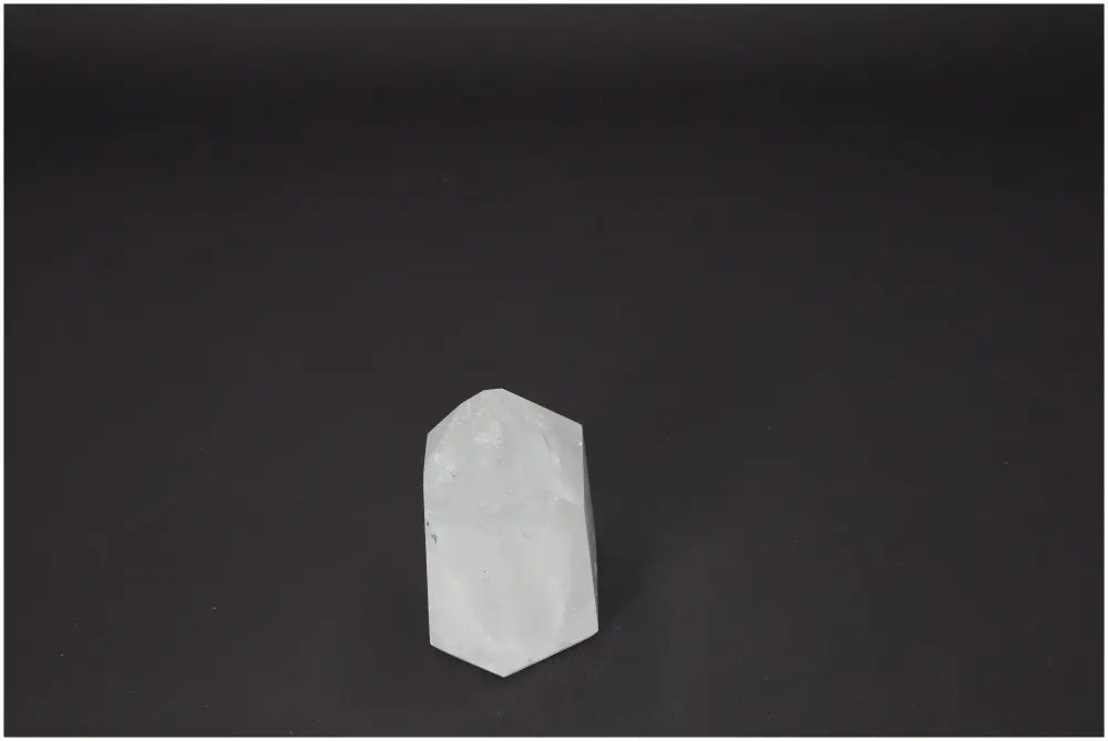 Elegant Lemurian Quartz Obelisk from Sylvia Crystals collection, ideal for spiritual purification and energy harmonization.