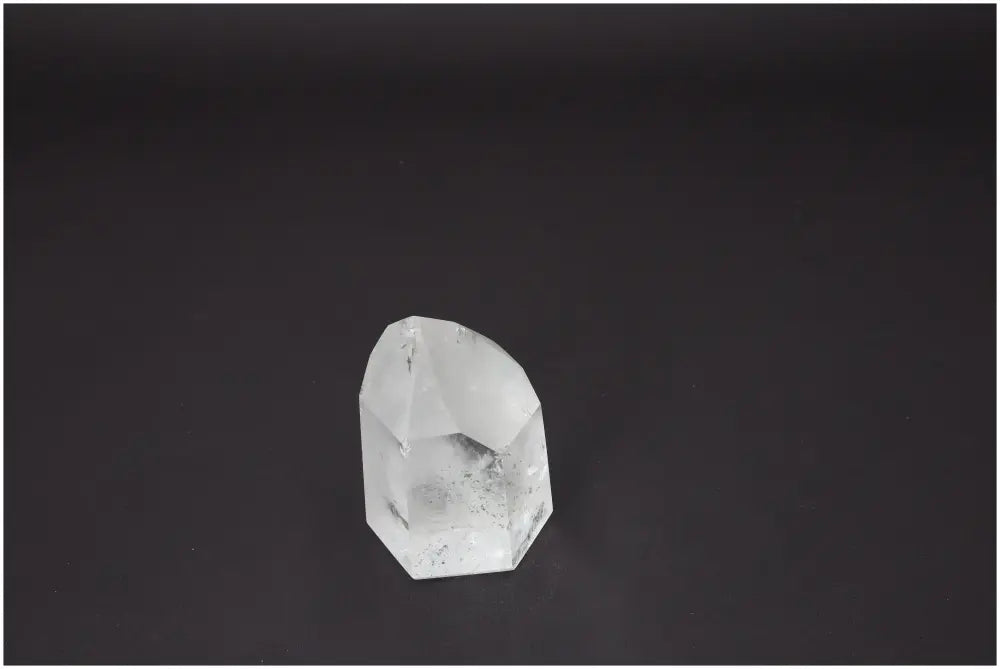 Lemurian Quartz Obelisk from Sylvia Crystals on a dark background, showcasing its transformative beauty and spiritual harmony properties.