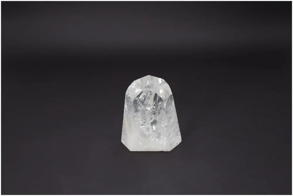 Lemurian Quartz Obelisk from Sylvia Crystals on a black background, showcasing its purity and spiritual enhancement qualities.