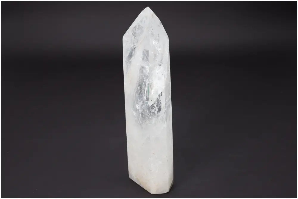 Lemurian Quartz Obelisk on black background, showcasing its clarity and transformative energy.
