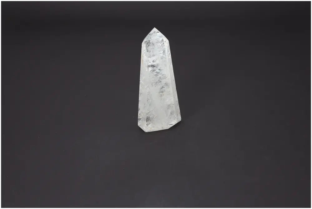 Lemurian Quartz Obelisk on dark background, featuring a premium crystal for luxury and spiritual harmony by Sylvia Crystals.