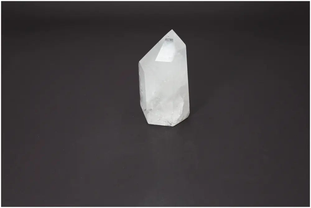 Lemurian Quartz Obelisk on black background, highlighting its clear, crystalline structure. Perfect for energy purification and spiritual harmony.