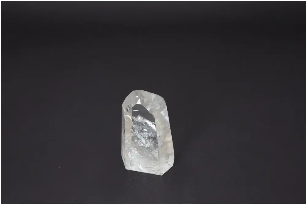 Lemurian Quartz Obelisk on black background, known for its unique energetic properties and chakra alignment, supporting spiritual needs.