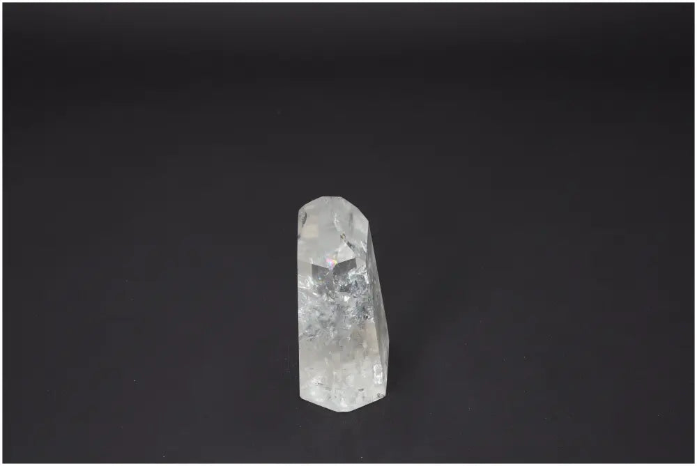 Lemurian Quartz Obelisk against black background, highlighting crystal clarity and unique structure for chakra and zodiac energy support.