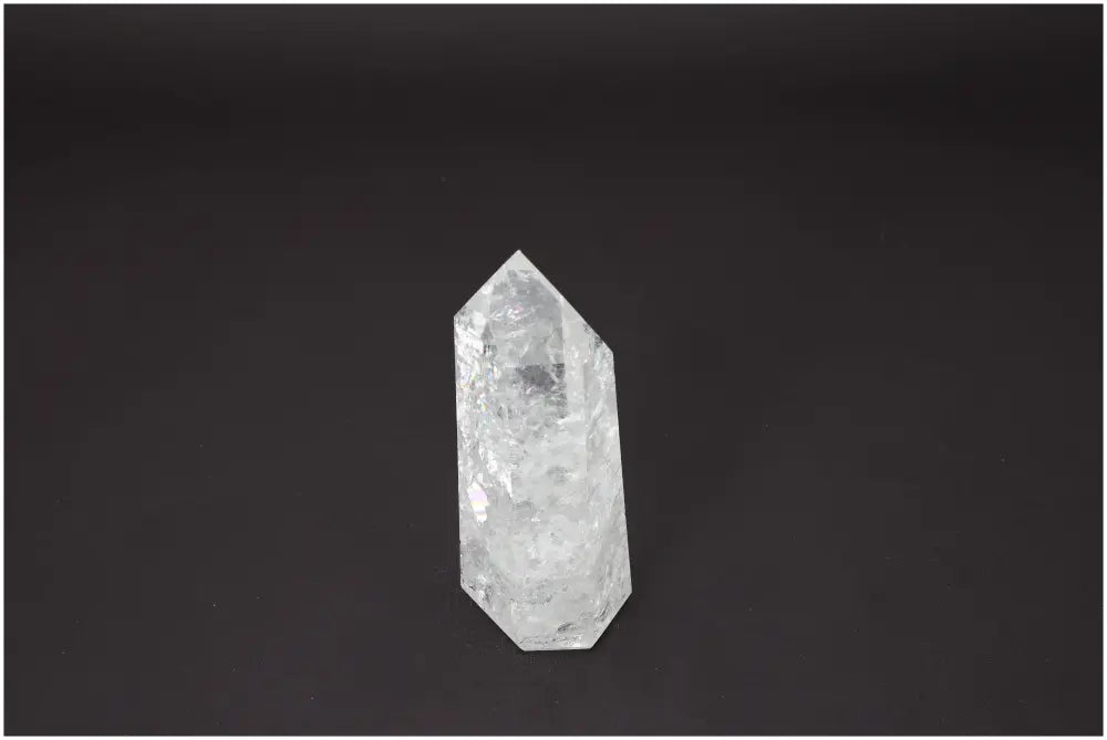 Lemurian Quartz Obelisk on black background, highlighting its unique properties and chakra associations for energy healing.
