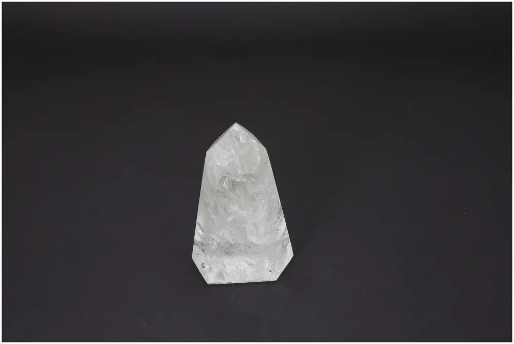 Lemurian Quartz Obelisk on black background, showcasing its unique crystal structure and spiritual energy properties.