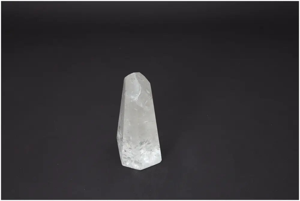 Lemurian Quartz Obelisk for chakra balancing and spiritual healing, featuring unique energy-enhancing properties on black background.