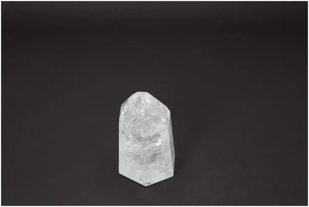 Lemurian Quartz Obelisk on dark background, showcasing its unique properties and energetic attributes for chakra and zodiac support.