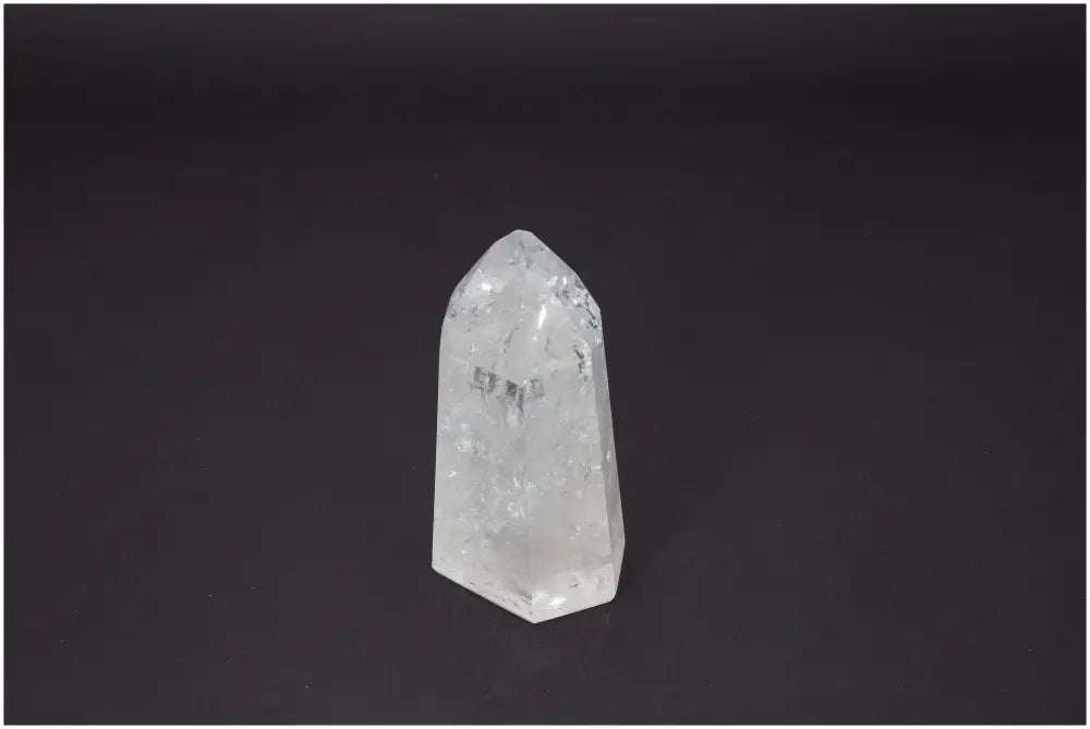 Lemurian Quartz Obelisk on black background, showcasing its natural clarity and unique energetic properties for chakra and zodiac alignment.