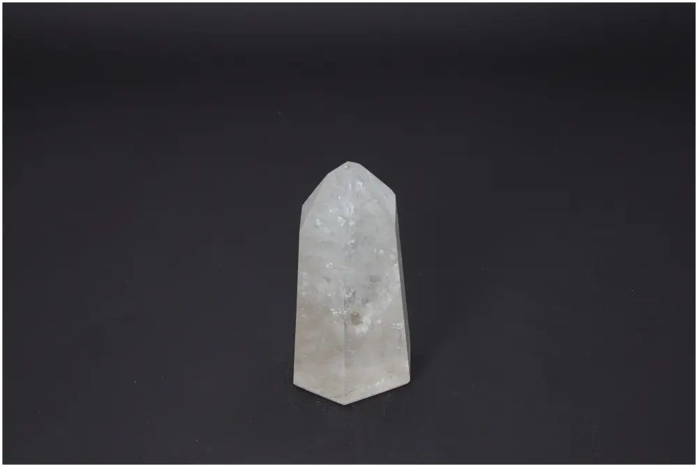 Lemurian Quartz Obelisk with unique energetic properties for chakra alignment and spiritual support on black background.