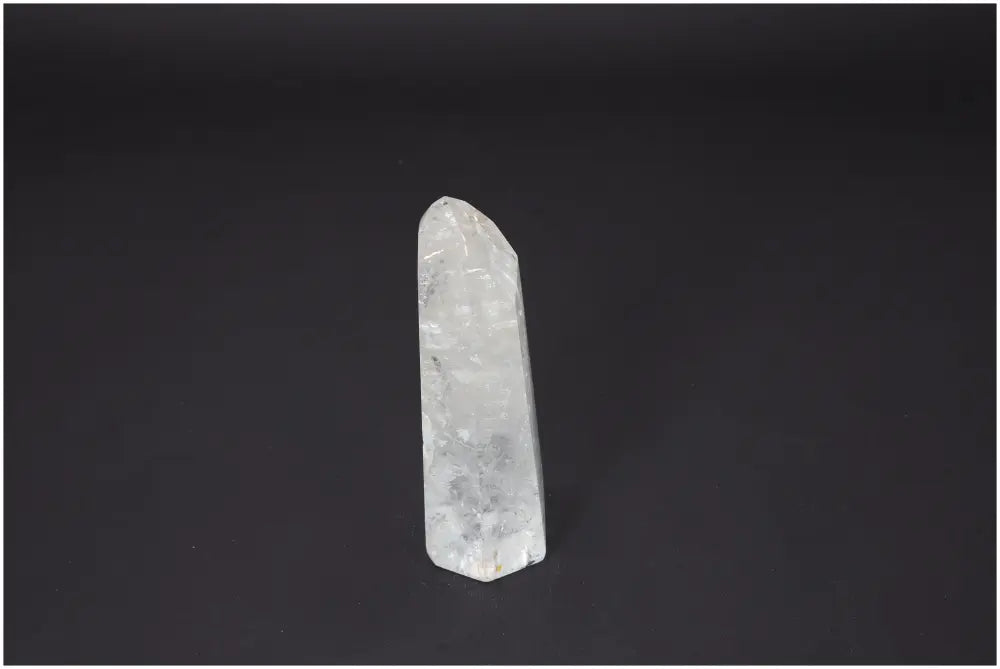 Lemurian Quartz Obelisk crystal on a dark background, ideal for chakra alignment and spiritual enhancement.
