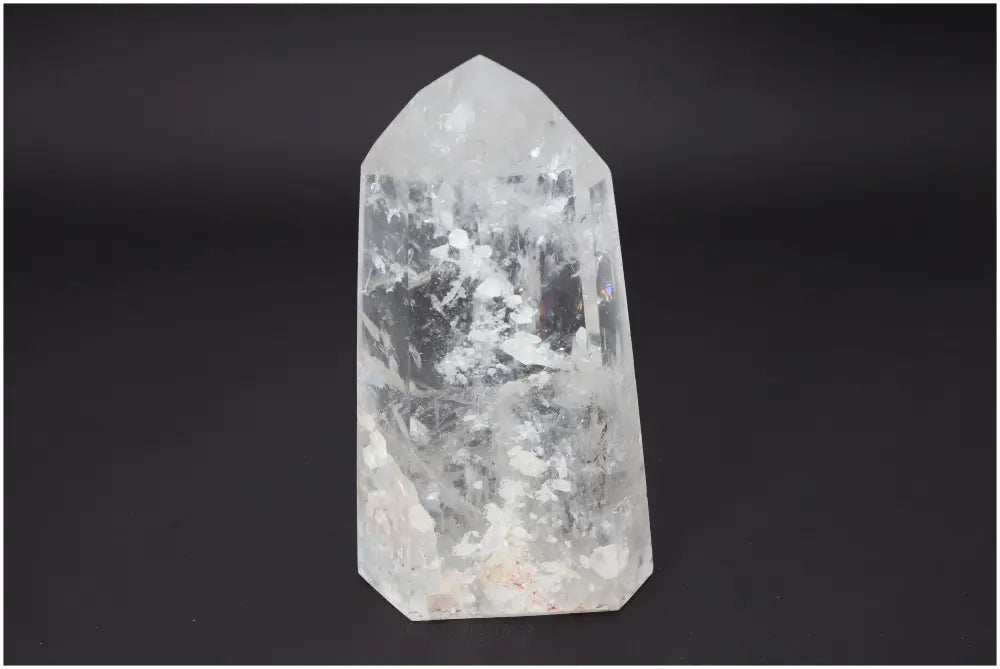 Lemurian Quartz Obelisk on dark background, showcasing crystal clarity and unique patterns for chakra and zodiac energy support.