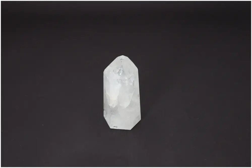 Lemurian Quartz Obelisk on dark background, showcasing its unique spiritual and energetic properties for chakra and zodiac support.