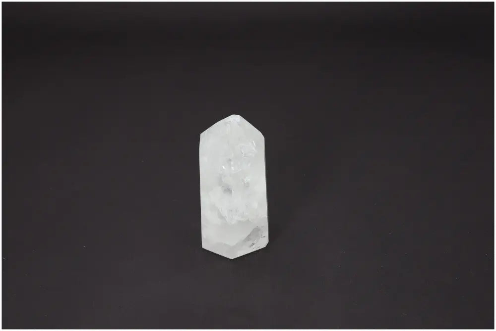 Lemurian Quartz Obelisk on black background, embodying chakra energies and supporting spiritual needs.