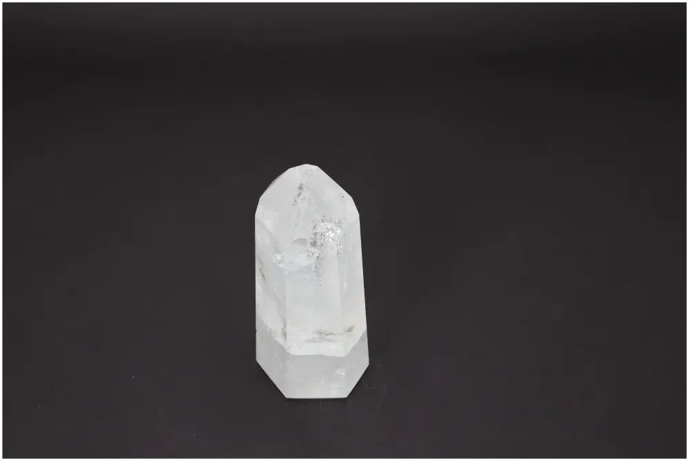 Lemurian Quartz Obelisk on a dark background, showcasing its clarity and potential energetic properties for chakra and zodiac support.