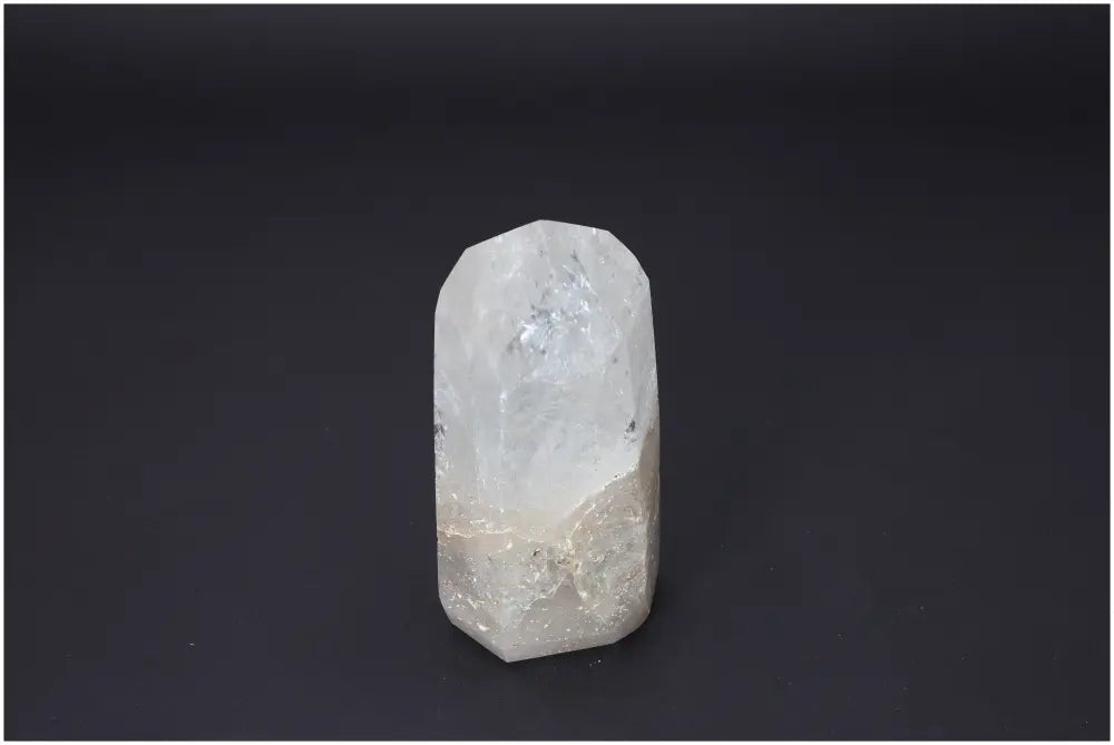 Lemurian Quartz Obelisk on black background, showcasing its unique properties for chakra and zodiac energy alignment.