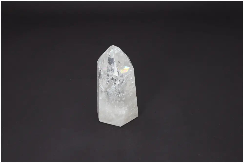 Lemurian Quartz Obelisk on dark background, highlighting its unique crystal clarity and spiritual energy properties.