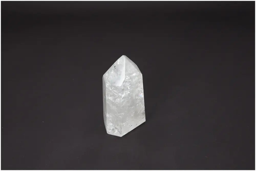 Lemurian Quartz Obelisk on dark background, ideal for chakra alignment and zodiac energy enhancement.