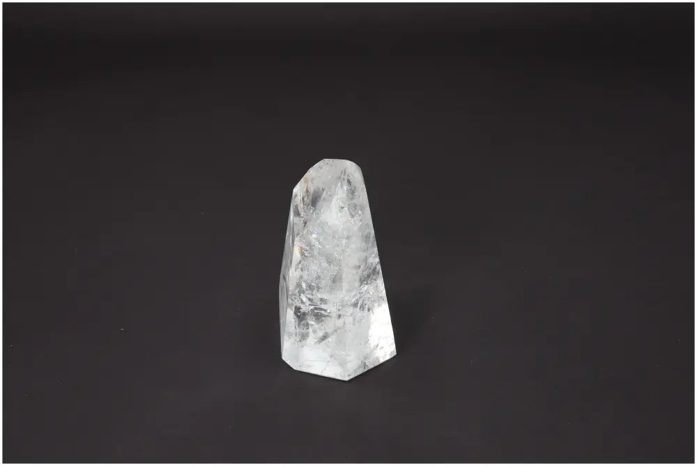 Lemurian Quartz Obelisk against a dark background showcasing its unique properties and energetic benefits for chakras and zodiac signs.