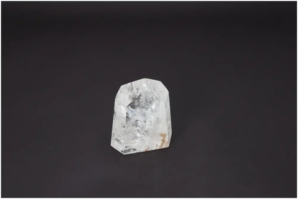 Lemurian Quartz Obelisk with unique properties enhancing chakra alignment and spiritual connection on a dark background.