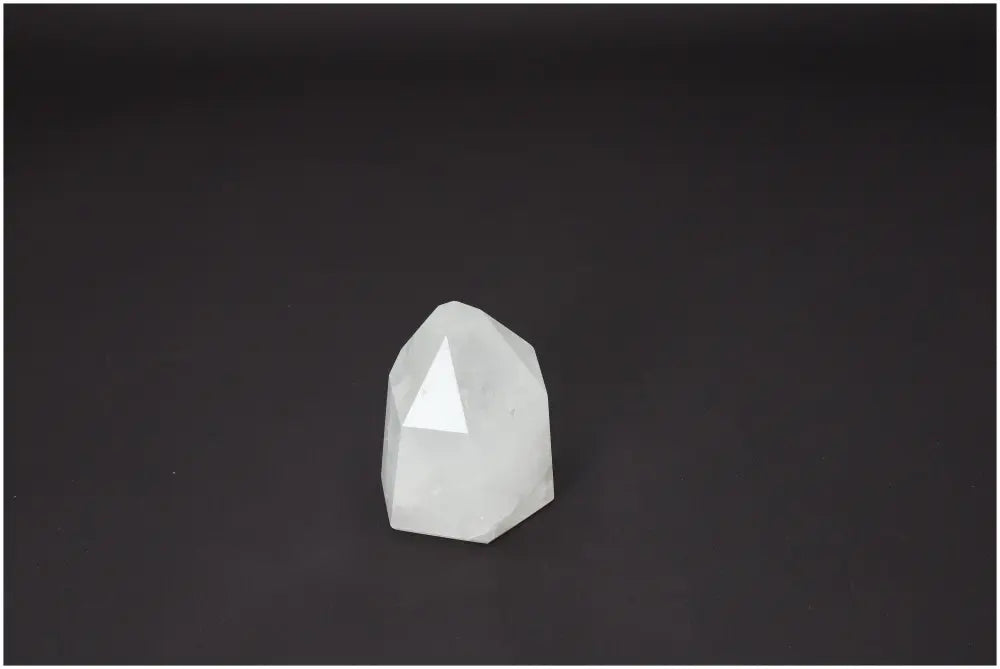Lemurian Quartz Obelisk on dark background, ideal for chakra alignment and spiritual enhancement, supporting energetic needs.