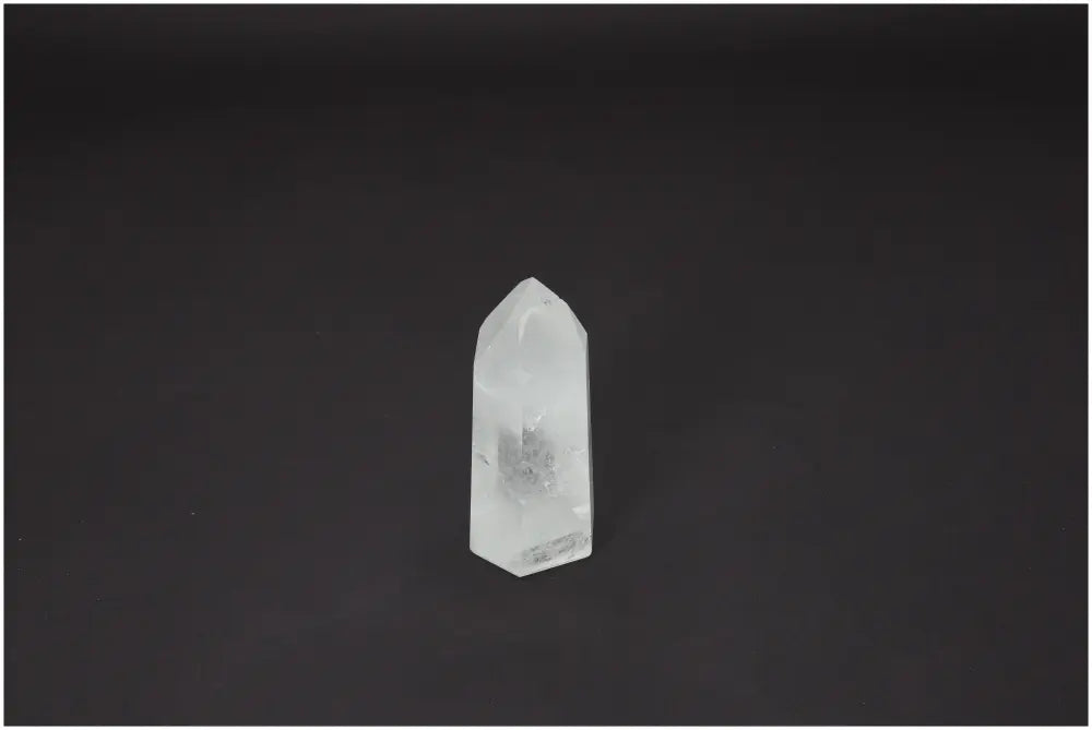 Lemurian Quartz Obelisk on a dark background, showcasing its unique energetic properties linked to chakras and zodiac signs.
