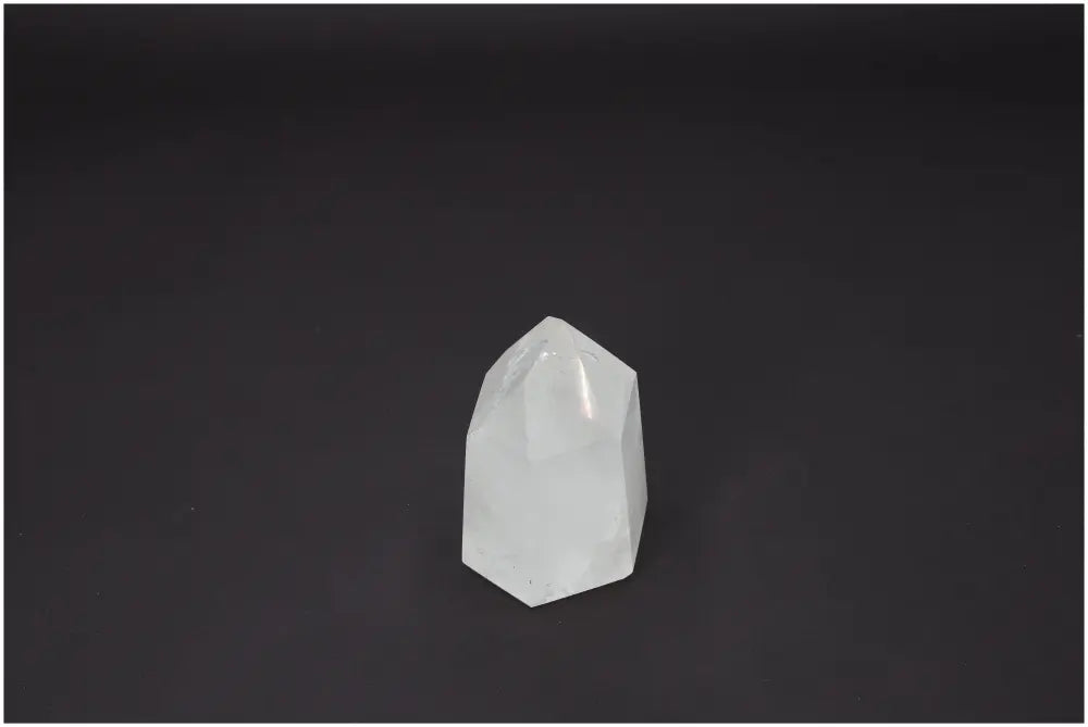 Lemurian Quartz Obelisk against black background, showcasing its unique properties for chakras and zodiac support.