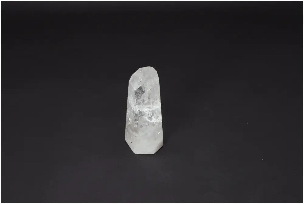 Lemurian Quartz Obelisk on black background showcasing unique properties for chakra and zodiac support.