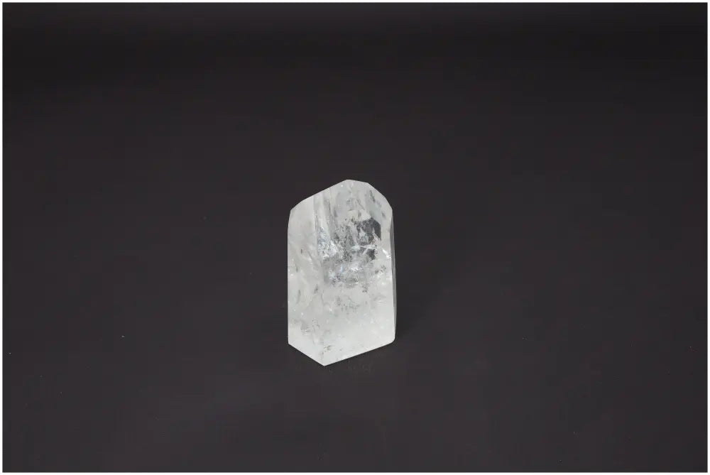 Lemurian Quartz Obelisk on dark background, highlighting its unique properties for chakra and zodiac support in energetic healing.