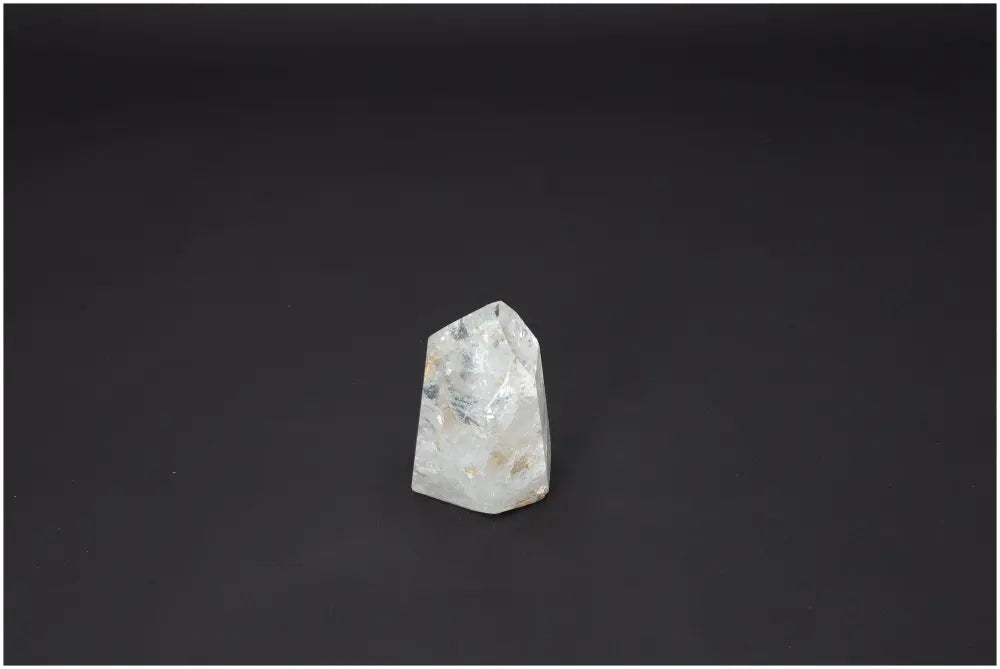 Lemurian Quartz Obelisk on a dark background showcasing its unique crystal properties and spiritual significance.